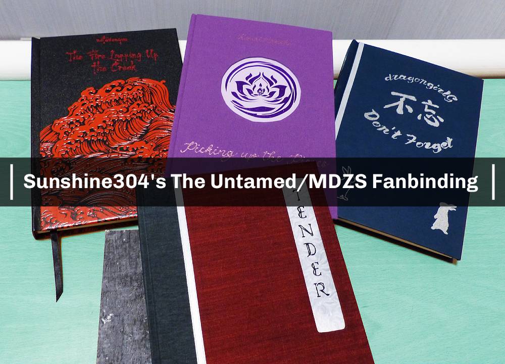 A photo of four handbound books with the words 'Sunshine304’s The Untamed/MDZS Fanbinding' printed across it.